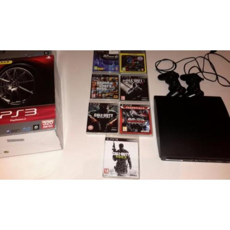 Playstation 3 in doos met 2 controllers + 15 spellen