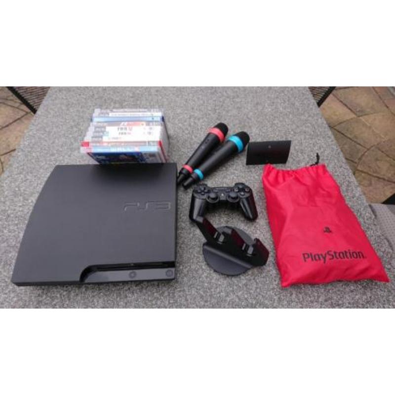 PS3 slim 320 GB met spellen en Singstar microfoons